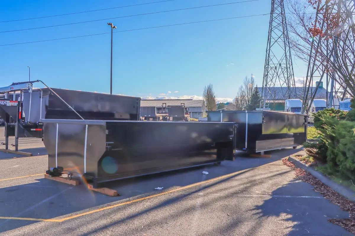 Roll-off dumpster ready for waste disposal at job site for 12 Yard Dumpster Rental in Matthews